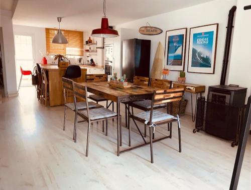a kitchen with a wooden dining table and chairs at BEACH HOUSE ! in Tarifa