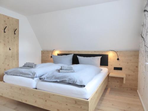 a bedroom with two beds with white sheets at Family Mountain Winterberg Chalet privates Haus 10 Pers 4 Schlafzimmer WiFi near Lift in Winterberg