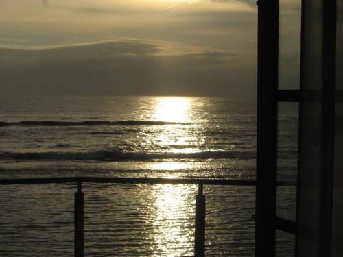 a view of the ocean at sunset from a cruise ship at Paradise Bay in Beruwala