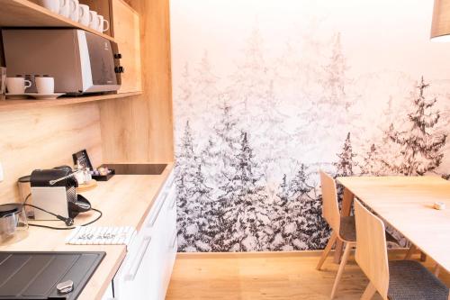 Kuchyň nebo kuchyňský kout v ubytování Amenity Hotel & Resort Špindlerův Mlýn