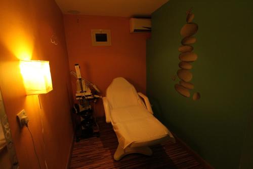 a room with a hospital bed in a room at Al Maha Residence Rak in Ras al Khaimah