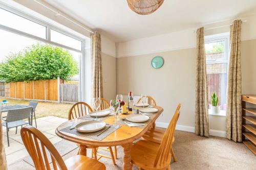 a dining room with a wooden table and chairs at Host & Stay - St Clements House in Norwich