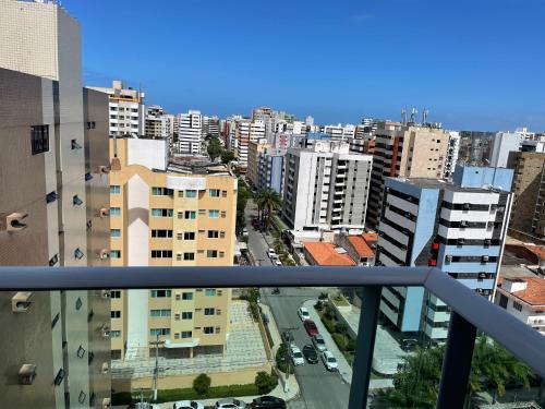 a view of a city from a balcony at Apartamento em Jatiúca in Maceió