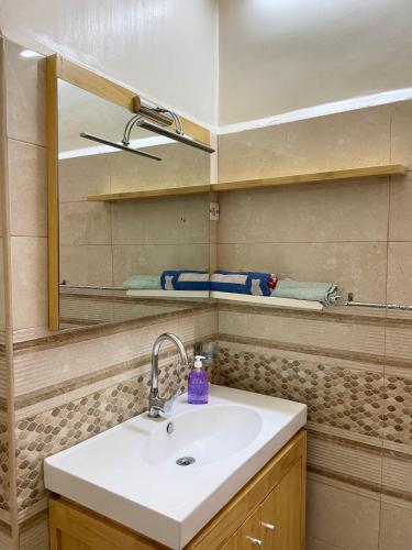 Ванная комната в Appartement Dans Immeuble Haussmanien