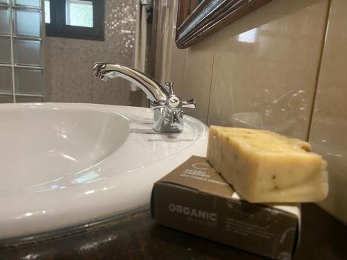 a block of cheese sitting on top of a bathroom sink at Roça Vale dos Prazeres in São Tomé