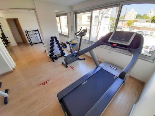 an overhead view of a gym with a treadmill at Eden Sea Breeze, 1 bed, Rooftop Pool, Gym in Limassol