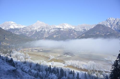 a view of a valley with snow covered mountains at Haus Rosina in Admont