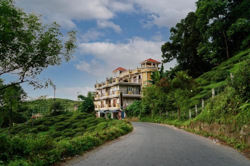 a building on the side of a road at Traditional Hotel & Restaurant !! Kurseong !! Best Hotel in Kurseong in Darjeeling