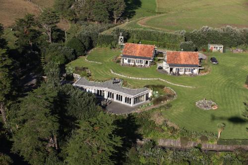 an aerial view of a large house with a yard at Ahu Ahu Beach Villas in Oakura