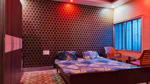 En eller flere senger på et rom på Hotel Nishi Pvt ltd