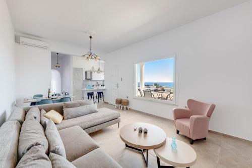 a living room with a couch and a table at Captain View in Ano Syros