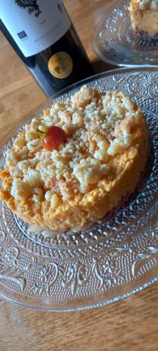 a pastry on a glass plate on a table at Arche de Lanoë jacuzzi in Labastide-Saint-Pierre