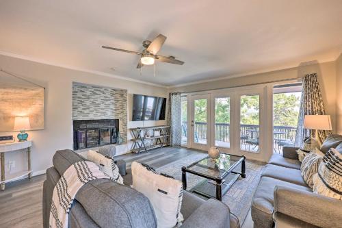 a living room with a couch and a fireplace at Hot Tub Access Fantastic Condo in Hot Springs! in Hot Springs