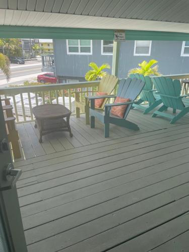 a patio area with a patio table and chairs at Hideaway Village in Fort Myers Beach