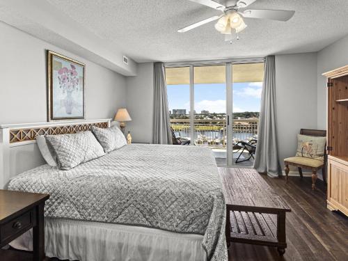 a bedroom with a bed and a window with a view at North Tower #802 Condo in Myrtle Beach