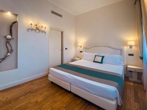 a bedroom with a large white bed in a room at Hotel Sant'Andrea in Santa Margherita Ligure