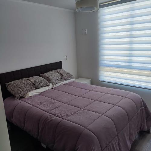 Rúm í herbergi á Ecobarrio I