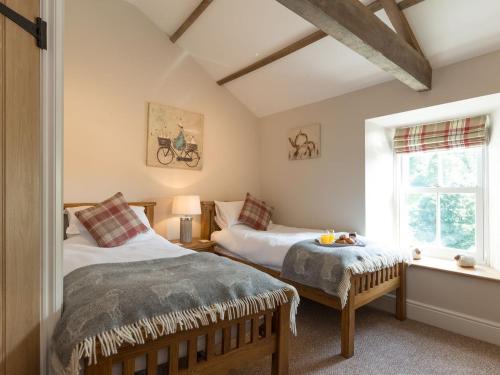 Ένα ή περισσότερα κρεβάτια σε δωμάτιο στο Abrahams Cottage