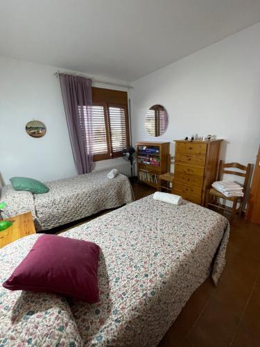 Llit o llits en una habitació de CA L' ANGELINA
