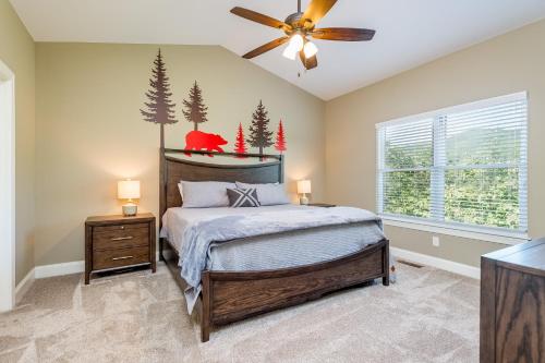 a bedroom with a bed and a ceiling fan at Winston's Ridge in Fairview