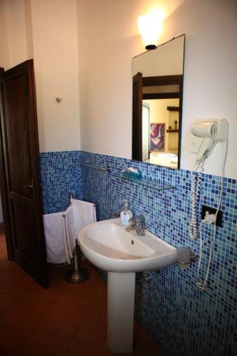 a bathroom with a sink and a mirror at Art Lincoln in Palermo