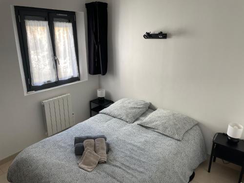 Postel nebo postele na pokoji v ubytování Au point de vue : Appartement face à la mer.