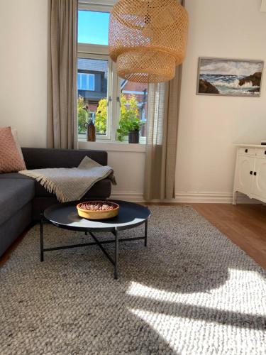 a living room with a couch and a table at The Photographer's House in Höganäs in Höganäs