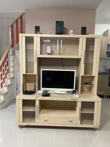 a large wooden entertainment center with a tv on it at M Villa @ Impact Muangthongthani in Ban Bang Phang