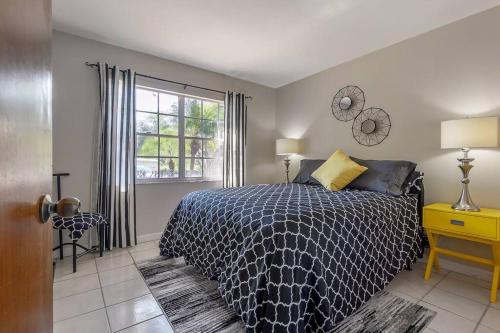 a bedroom with a large bed and a window at Fifties Flat MidCentury flat in heart of Brandon in Brandon
