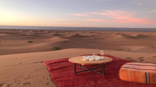 a table in the middle of the desert at Bivouac Karim Sahara in Zagora