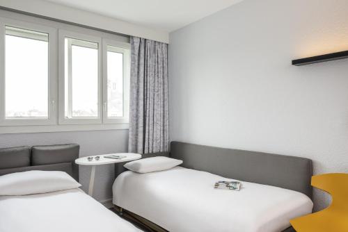 Postel nebo postele na pokoji v ubytování ibis Styles Meaux Centre