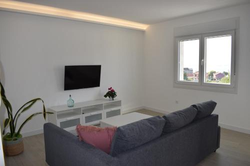 TV a/nebo společenská místnost v ubytování Apartamento Corcubica mirando al mar