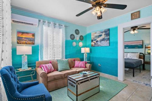 a living room with a couch and a bed at Mermaids Grotto WATERFRONT 1BR Apt with Bay View in Tampa