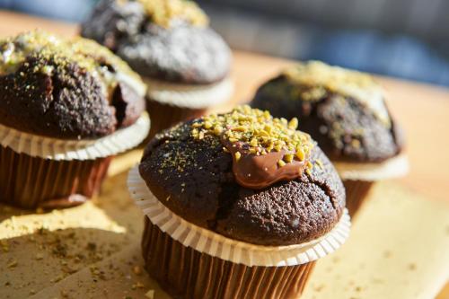 a group of chocolate muffins sitting on a table at Hotel A Casa Nostra in Rimini
