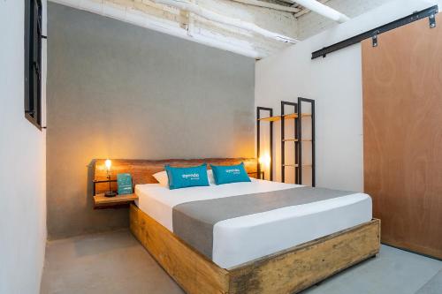 Un pat sau paturi într-o cameră la Ayenda Flora Jaguar