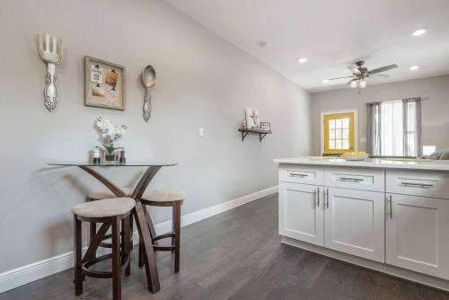 a kitchen with a table and chairs and a counter at 2 Historic Ybor City Bungalows in the heart of Ybor City in Tampa