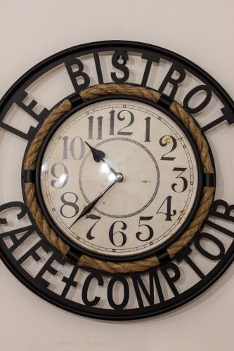 a clock is hanging on a wall at Suite Garibaldi - Smart Holiday in Mantova