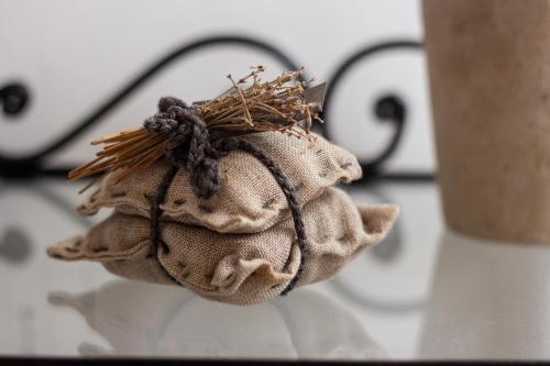 a piece of cloth sitting on a table with a cup at Suite Garibaldi - Smart Holiday in Mantova