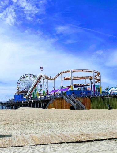 an amusement park with a roller coaster and a ferris wheel at The Best Santa Monica Beach Area, Any days,Newly Remodeled in Los Angeles