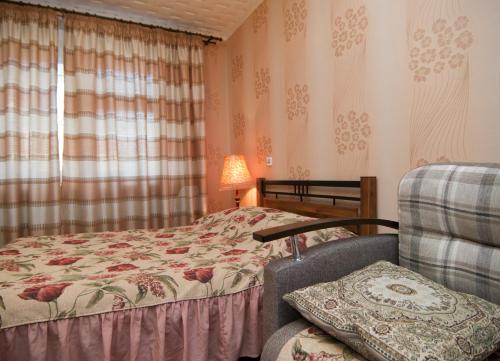 
Кровать или кровати в номере Uyut Apartments Chekhova
