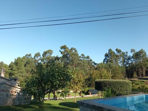 a view of the garden and swimming pool at Casa da rosinha - Minho, Portugal in Arcos de Valdevez