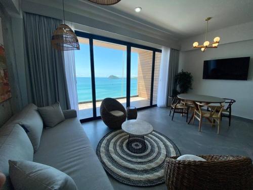 a living room with a couch and a table at Departamento catania con vista al mar in Mazatlán
