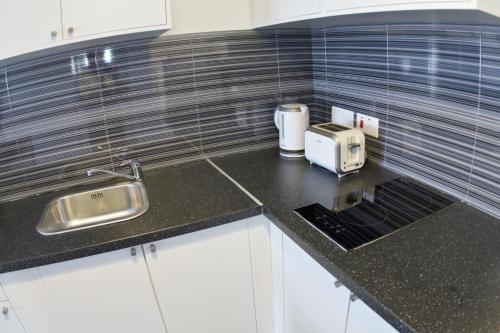 Η κουζίνα ή μικρή κουζίνα στο Margarita Napa Apartments