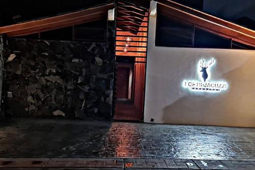 a building with a sign on the side of it at No 1 Loft Jacuzzi Mazamitla in Mazamitla