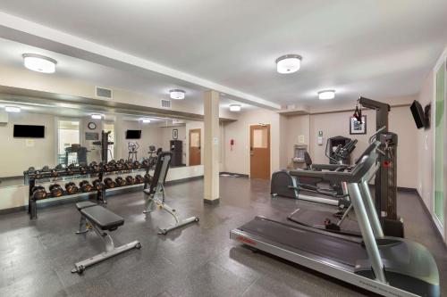 a gym with treadmills and elliptical machines at Best Western PLUS Fort Saskatchewan Inn & Suites in Fort Saskatchewan