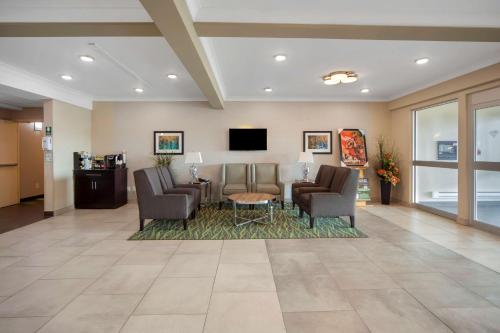 a lobby with a waiting room with chairs and a table at Best Western PLUS Fort Saskatchewan Inn & Suites in Fort Saskatchewan