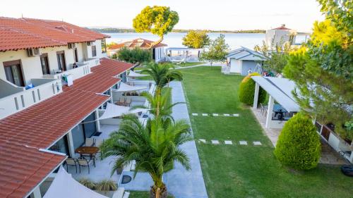 an aerial view of the courtyard of a resort at Zinozis Beach Apartments in Vourvourou