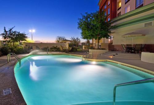 a swimming pool in the middle of a building at Holiday Inn & Suites Phoenix Airport by IHG in Phoenix