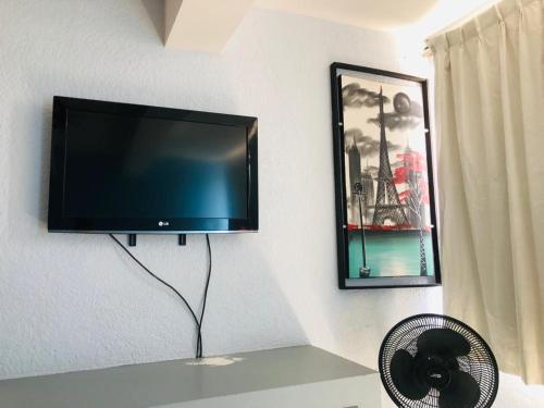 TV a/nebo společenská místnost v ubytování HOTEL Posada Aguascalientes