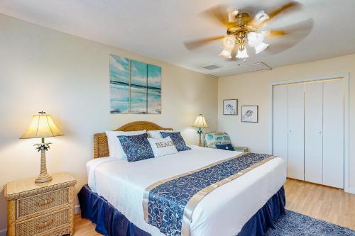 a bedroom with a bed and a ceiling fan at Island Palms in St. George Island